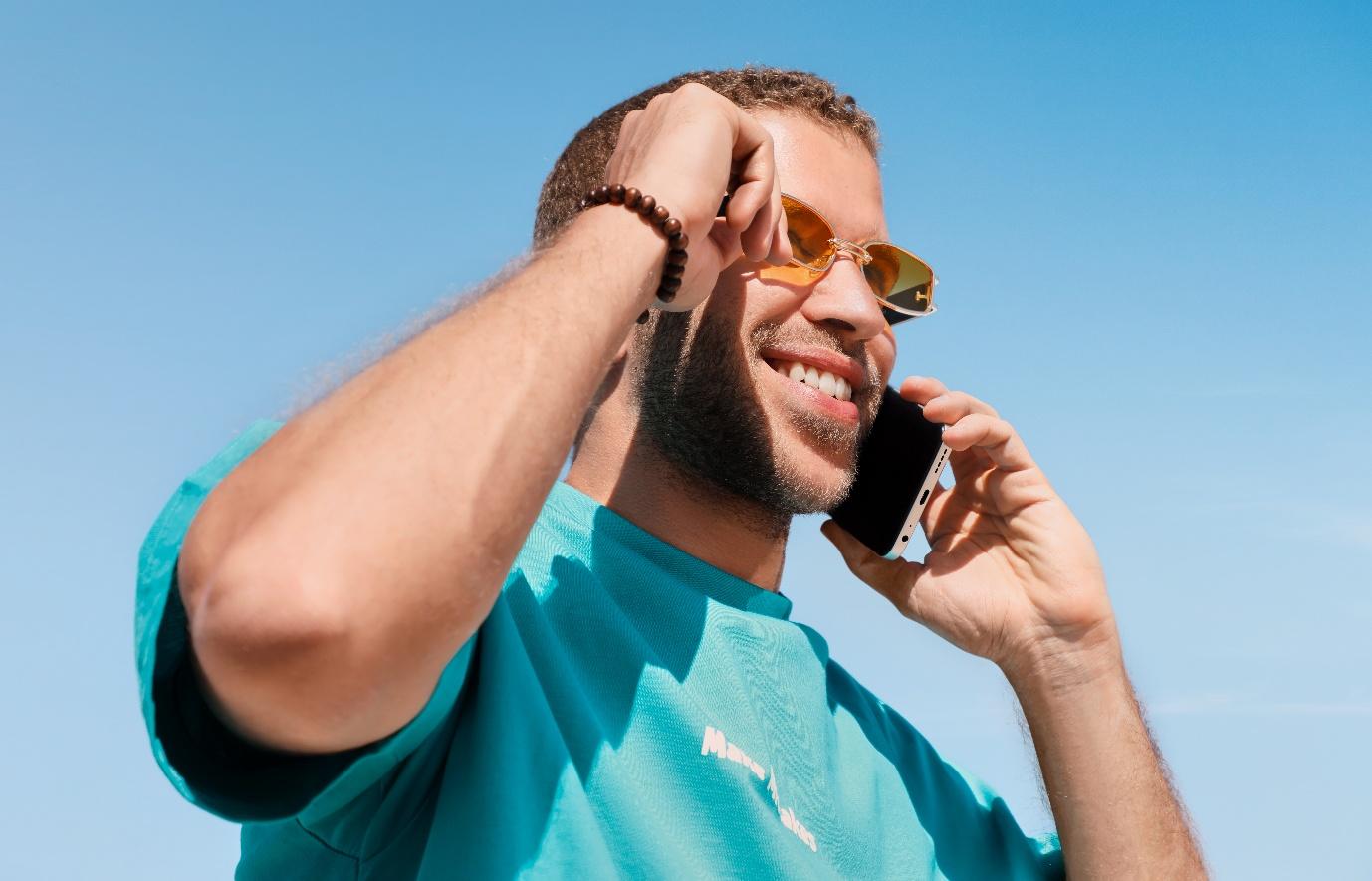 A person holding a phone to his ear
AI-generated content may be incorrect.